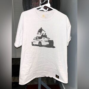 Yellow Rat Bastard Skateboard over Cop car Tee shirt